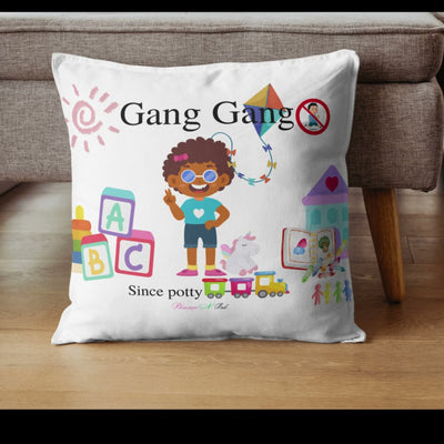 small couch pillow with young girl and toys on pillow